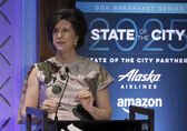 Mayor Lynne Robinson speaks at a podium.
