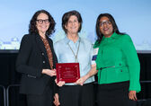 City Manager Diane Carlson (left), Mayor Lynne Robinson (center) and HDC executive director Patience Malaba pose with the 2025 award.