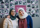 Two women participating in Cultural Conversations pose for a photograph.