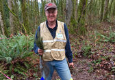 One of Bellevue's naturalists plants trees and shrubs in the forest at Eastgate Park.