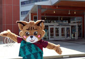 Belle the Bobcat, the city mascot, stands in front of City Hall.