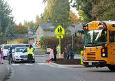 Students walk across a street