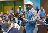 A gentleman speaks at an event.