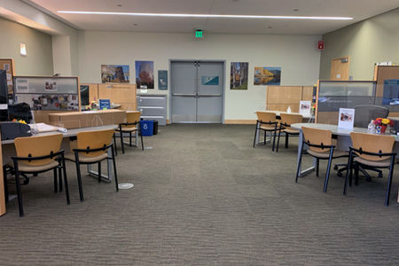 Permit center with desks and tables spaced out