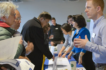 Residents and City employees at a review table