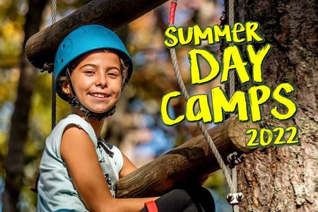 2022 Summer Day Camp brochure showing a picture of a smiling girl wearing a bright blue helmet on a challenge course.