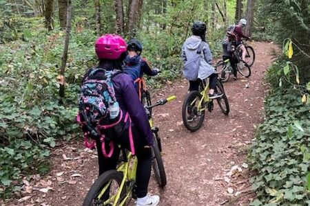 Tracks Adventure Camp biking on trail