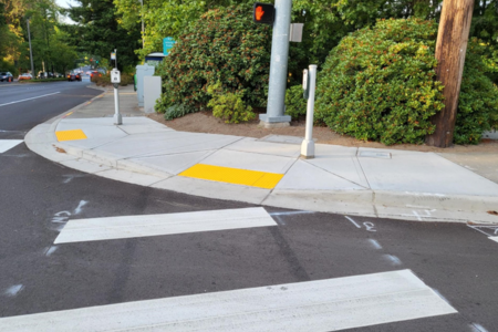 accessible intersection, curb ramps, audible pedestrian signal