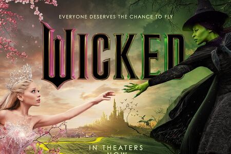 Wicked movie poster showing Galinda and Elphaba reaching out to one another