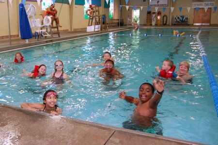 children swimming in pool at Bellevue Aquatic Center