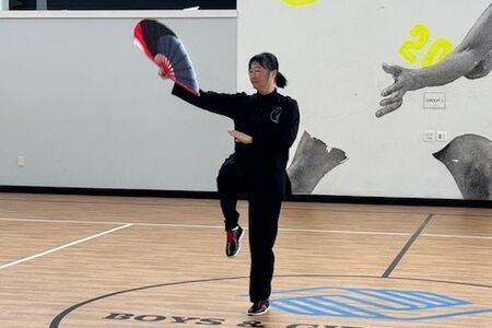 woman in tai chi pose 