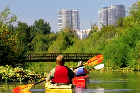 People kayaking in Mercer Slough