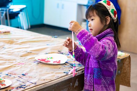 Child works on art project at Northwest Arts Center