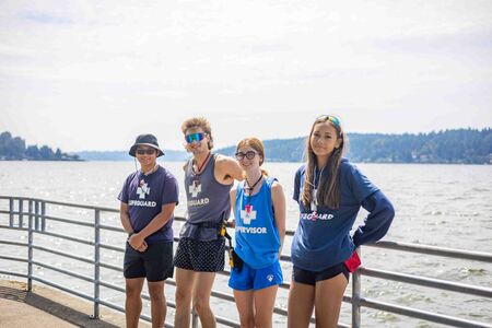 Group of lifeguards smile for group photo at Newcastle Beach Park