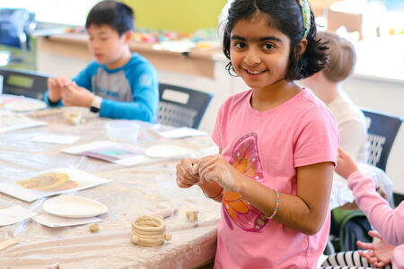 Child works on art project at Northwest Arts Center