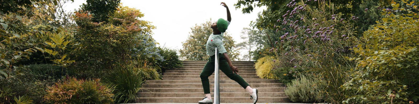 Image of artist David Rue performing on a staircase for Bellwether in the Bellevue Botanical Gardens. Image by Jordan Rennick and Brandon Freeman, Front Runner Films.