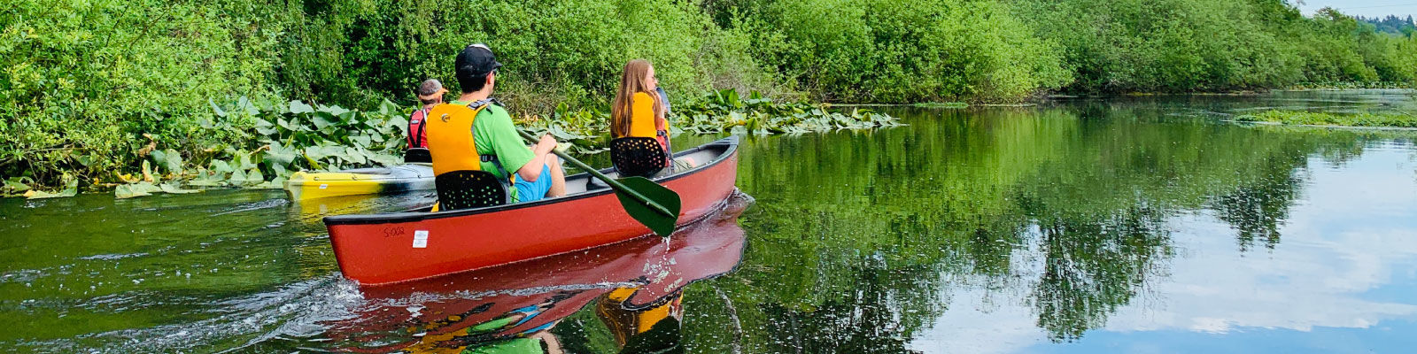 People in canoes exploring Mercer Slough Nature Park.