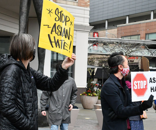 Bellevue residents protest hate crimes against Asian Americans at a rally downtown in March 2021.