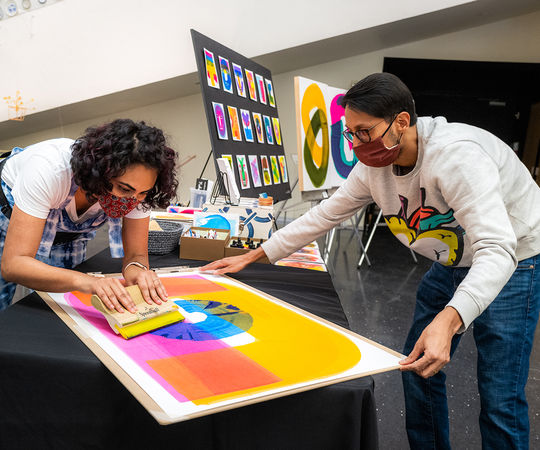 Artist Neha Panicker creates works at Bellevue's Bellwether event. Photo by Nate Gowdy