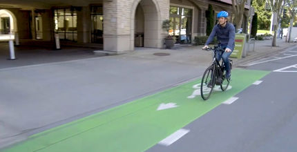 A bicyclist rides the 108th Avenue bikeway downtown.
