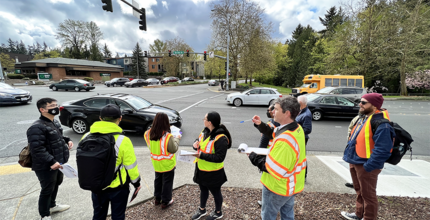 Staff and residents consider potential street design hazards during a road safety assessment.