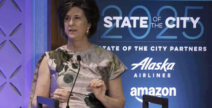 Mayor Lynne Robinson speaks at a podium.