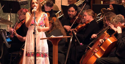 The Lake Washington Symphony Orchestra performs with a woman singing.