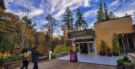 People walk toward the entrance of the South Bellevue Community Center.