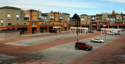 There are many empty parking stalls at a Bellevue shopping center.