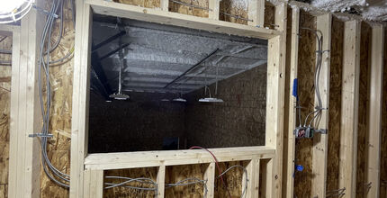 With a city arts grant, Theatre33 undergoes a renovation, with a new wall featuring new wiring and box office.