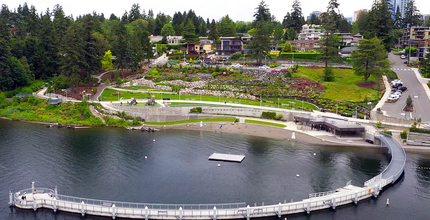 The beach and pier of Meydenbauer Bay Park seen from above, with downtown Bellevue behind them.