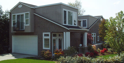 A detached accessory dwelling unit stands on a neighborhood corner.