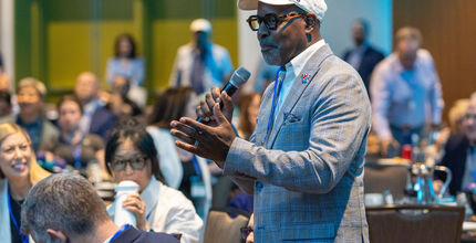 A gentleman speaks at an event.