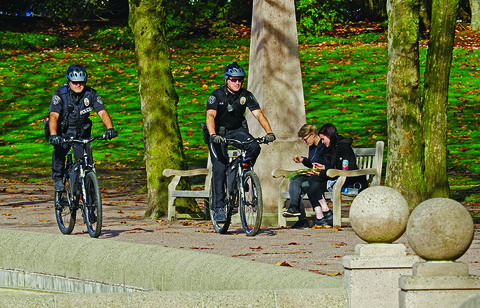 A bike patrol team monitors Downtown Park.