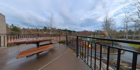image of outdoor patio with picnic table overlooking playground
