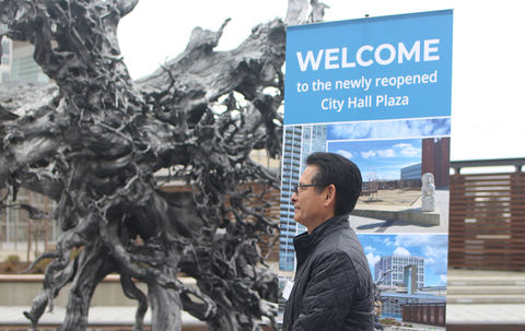 City Manager Brad Miyake stands at the reopening of the City Hall plaza in March 2023 