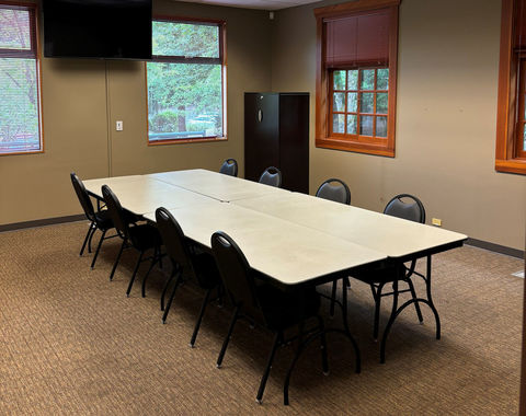 image of meeting room with table and 8 chairs