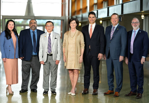 The City Council stands on the City Hall concourse.
