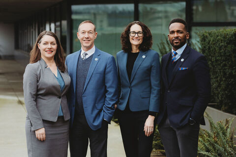 From left, Deputy City Manager Genesee Adkins, Deputy City Manager Nathan McCommon, City Manager Diane Carlson and Deputy City Manager Joseph Todd stand by City Hall.