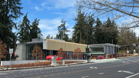 Fire Station 10 stands in front of tall evergreen trees.