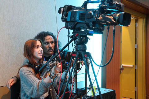 Bellevue TV staff aim a camera during an event.