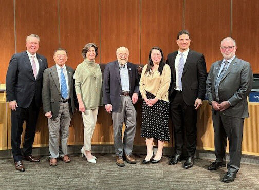 The City Council poses in the council chamber with new member Claire Sumadiwirya