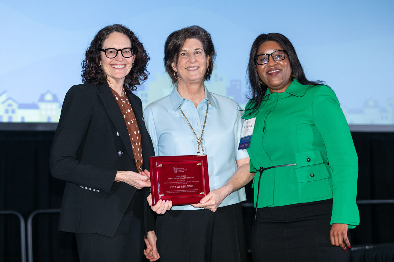 City Manager Diane Carlson (left), Mayor Lynne Robinson (center) and HDC executive director Patience Malaba pose with the 2025 award.