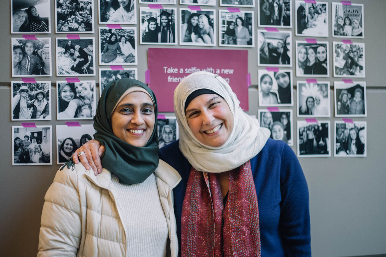 Two women participating in Cultural Conversations pose for a photograph.