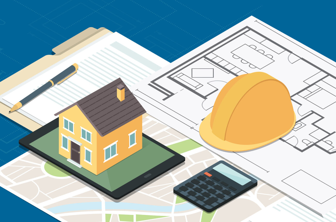 A miniature house and a hardhat sit on blueprints.