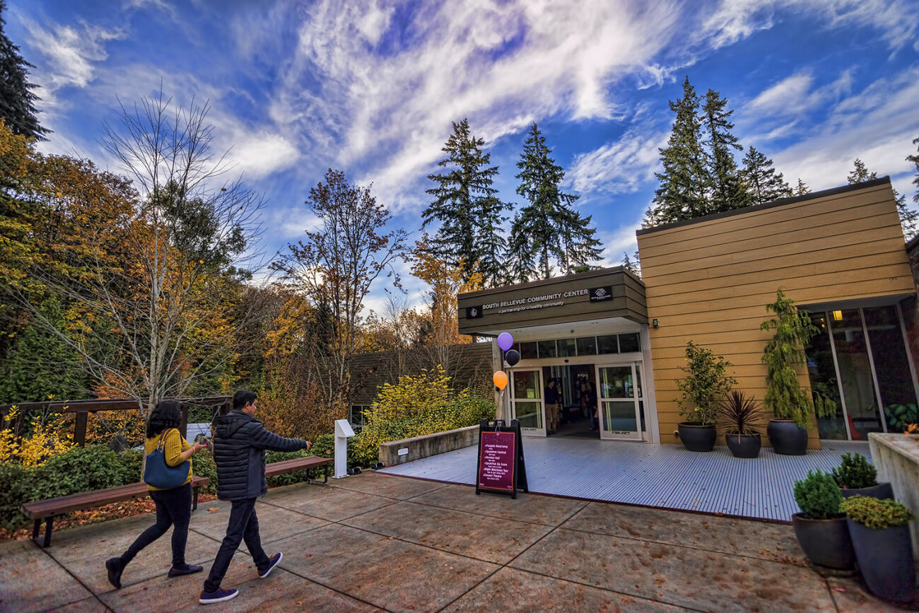 People walk toward the entrance of the South Bellevue Community Center.