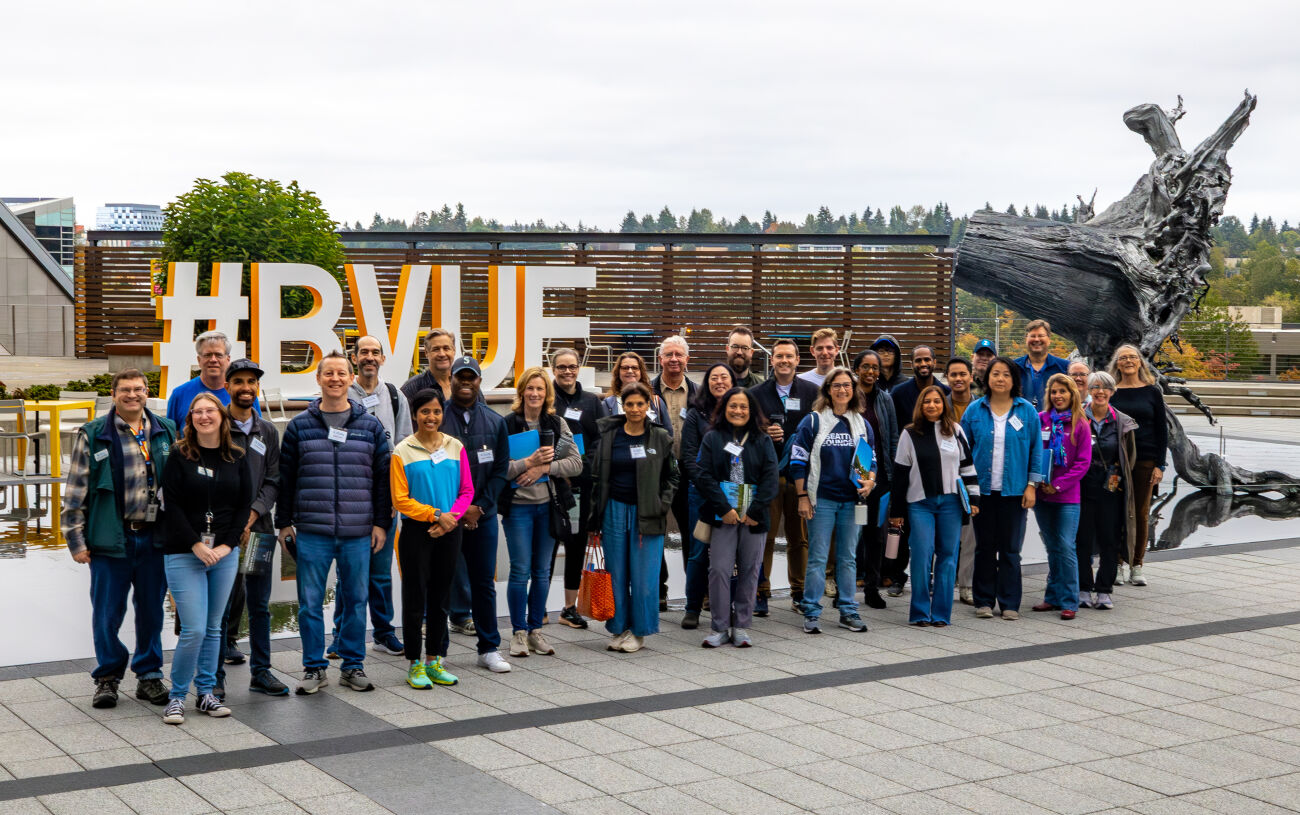 A Bellevue Essentials class stands together on the City Hall plaza.