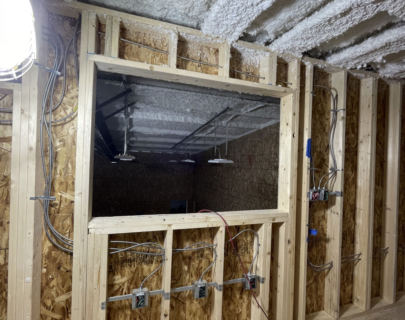 With a city arts grant, Theatre33 undergoes a renovation, with a new wall featuring new wiring and box office.