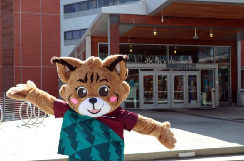 Belle the Bobcat, the city mascot, stands in front of City Hall.