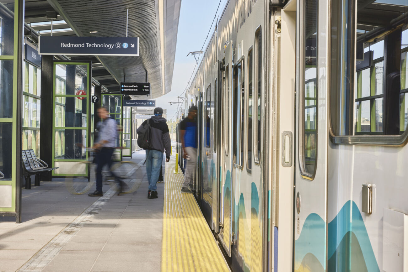 People board the 2 Line at the 130th Street station.